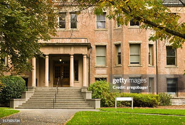 brick facade of a university building on campus - empty school building stock pictures, royalty-free photos & images