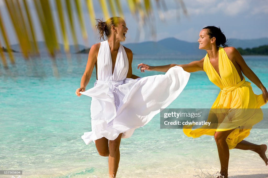 Women Wearing Beach Wedding Dresses High-Res Stock Photo - Getty Images