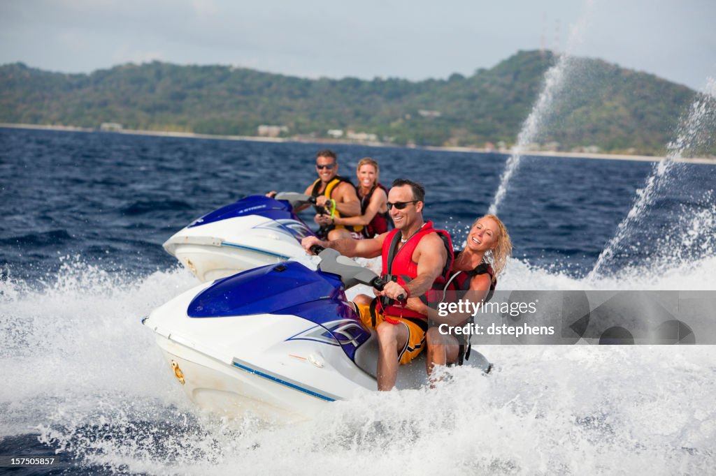 Adult couple riding jet boats