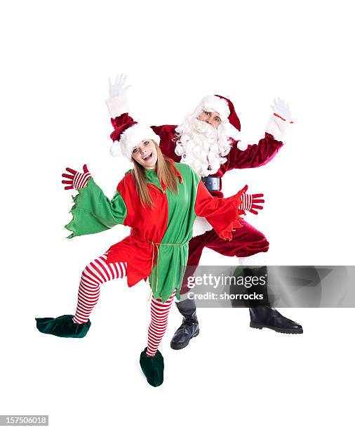 santa y elf dancing (cuerpo completo - santa elf fotografías e imágenes de stock