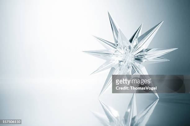 crystal star. ice glass snowflake light snow art christmas - glass christmas ornament stock pictures, royalty-free photos & images