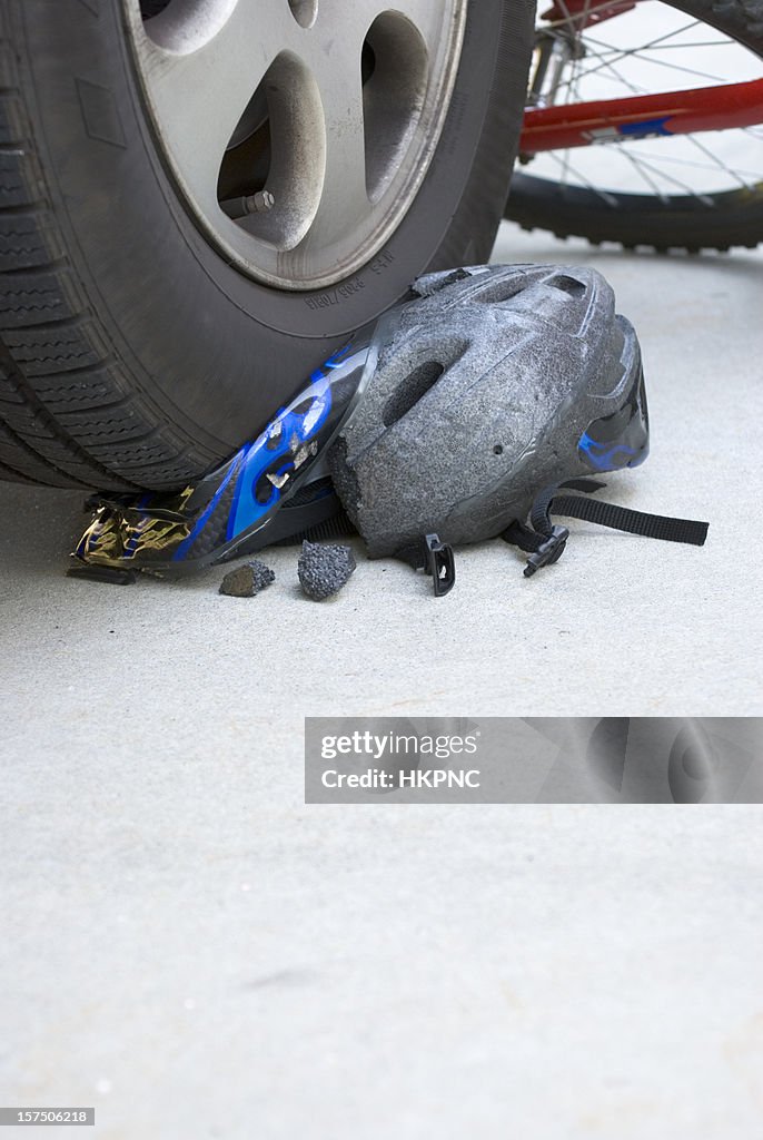 Bike Accident Helmet Crushed By Car Tire Vertical