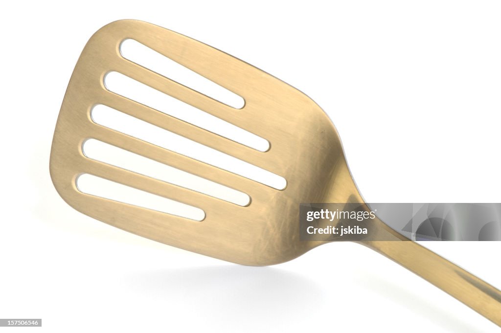 Stainless steel spatula on a white background