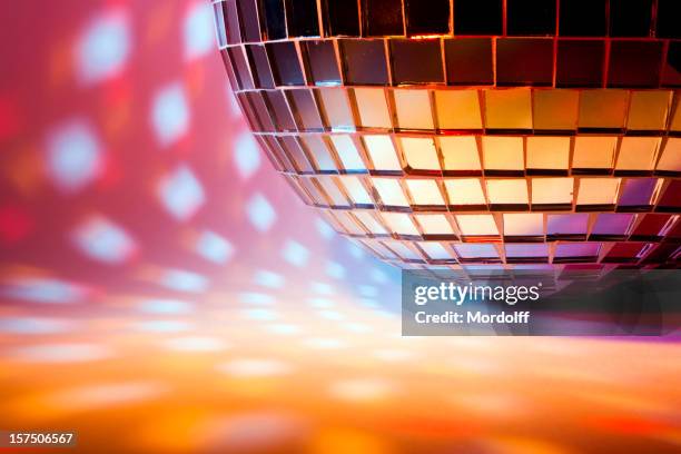 disco sphere with colored spot lights - night club stock pictures, royalty-free photos & images