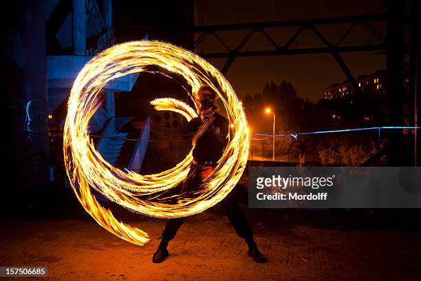 fire dancer in abandoned building - in flames i the mask stock pictures, royalty-free photos & images