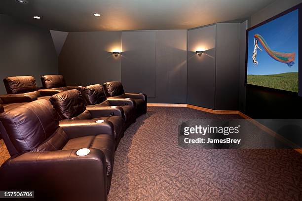 home theater room with leather recliners - home theatre stock pictures, royalty-free photos & images