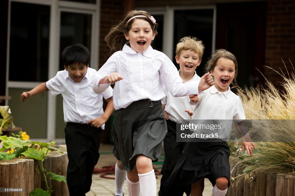 Primary school: junior school children running out of their school