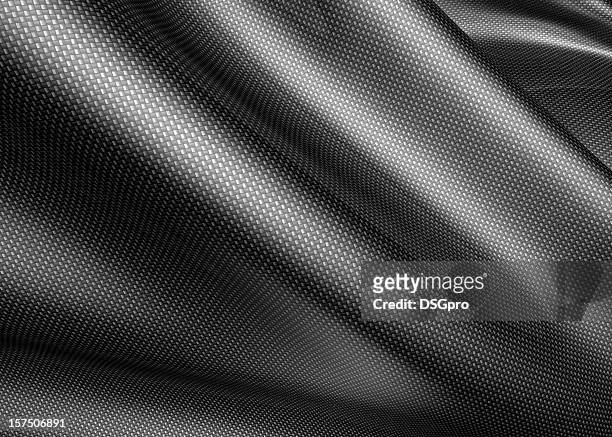 a carbon fiber sheet, about to be molded  - carbon fibre stockfoto's en -beelden