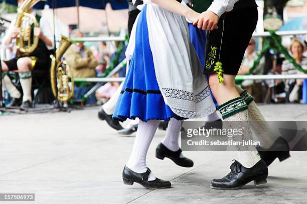 bavarian couple dancing at beer fest - polka dancing stock pictures, royalty-free photos & images