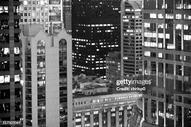 high-rise buildings at night - chicago black and white stock pictures, royalty-free photos & images