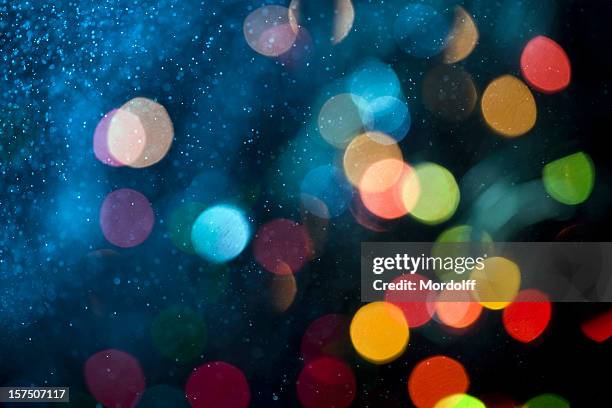 abstract patern with water spray and defocused lights - illuminated stock pictures, royalty-free photos & images