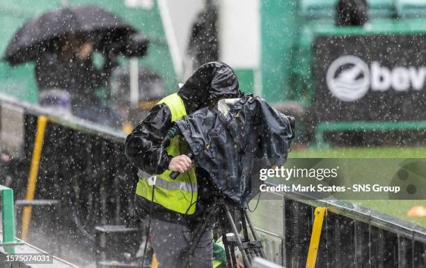 Camera operator braves the rain during a UEFA Europa Conference League qualifier between Hibernian and Inter Club d'Escaldes at Easter Road, on...