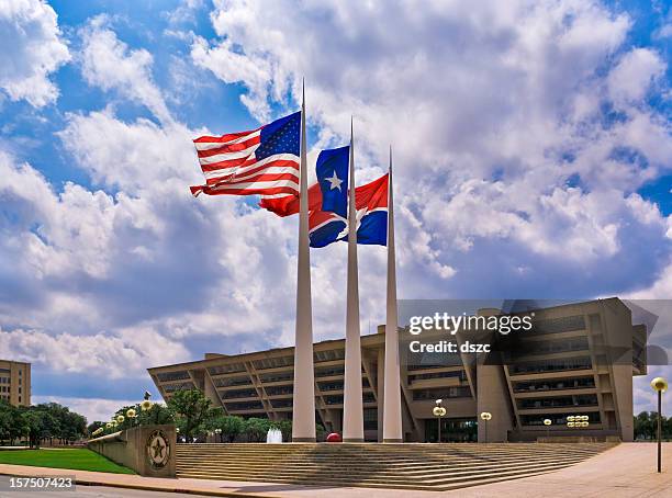 flags in front of dallas city hall - town hall building stock pictures, royalty-free photos & images