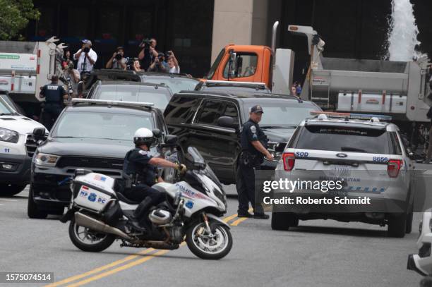 The motorcade carrying former US President Donald Trump arrives at the E. Barrett Prettyman US Court House in Washington, DC, US, on August 3, 2023...