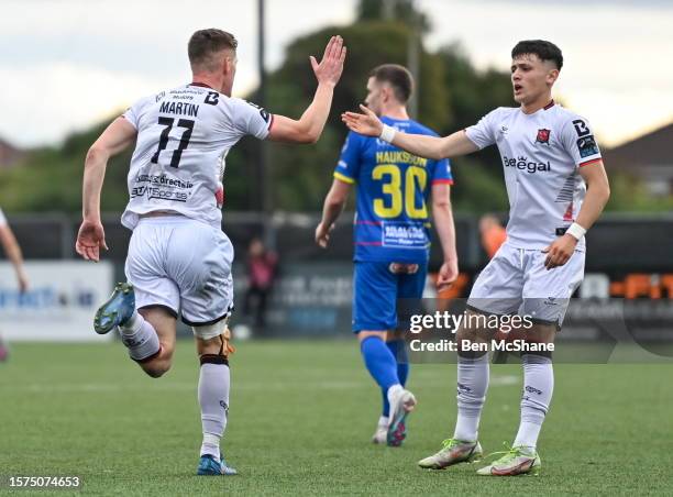 Louth , Ireland - 3 August 2023; John Martin of Dundalk celebrates with teammate Ryan O'Kane, right, who assisted, after scoring their side's first...