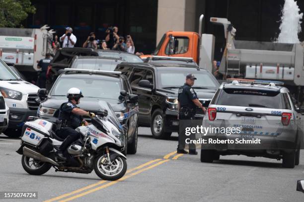 The motorcade carrying former US President Donald Trump arrives at the E. Barrett Prettyman US Court House in Washington, DC, US, on August 3, 2023...