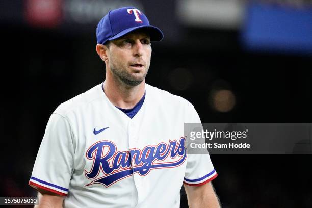 Max Scherzer of the Texas Rangers returns to the dugout between innings during the game between the Chicago White Sox and the Texas Rangers at Globe...