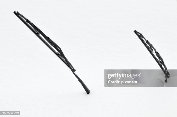 two windscreen wipers poking out of a blanket of snow - auto wipers stock pictures, royalty-free photos & images