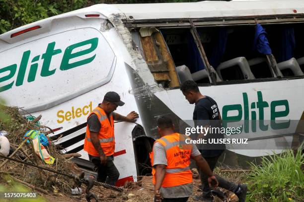 Rescuers work at the site of a road accident in Tepic, Nayarit State, Mexico, on August 3, 2023. At least 15 people were killed Thursday when a bus...