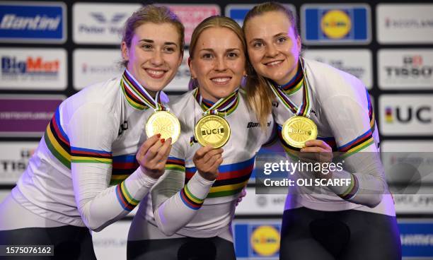 The German team celebrate with their gold medals after winning the women's Elite Team Sprint Final at the Sir Chris Hoy velodrome during the Cycling...