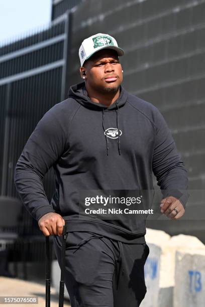 Quinnen Williams of the New York Jets enters the stadium prior to the 2023 Pro Hall of Fame Game against the Cleveland Browns at Tom Benson Hall Of...