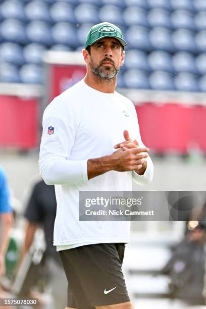 Aaron Rodgers of the New York Jets looks on prior to the 2023 Pro Hall of Fame Game against the Cleveland Browns at Tom Benson Hall Of Fame Stadium...