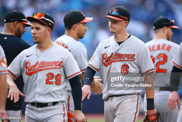 Ryan Mountcastle of the Baltimore Orioles celebrate the win with teammates against the Toronto Blue Jays at Rogers Centre on August 3, 2023 in...