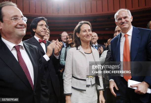 French Socialist Party's candidate for France's 2007 presidential elections Segolene Royal smiles next to French socialist party leader Francois...