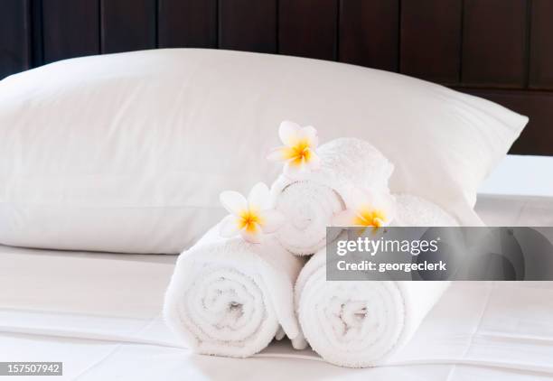 luxury hotel bed close-up - towel stockfoto's en -beelden