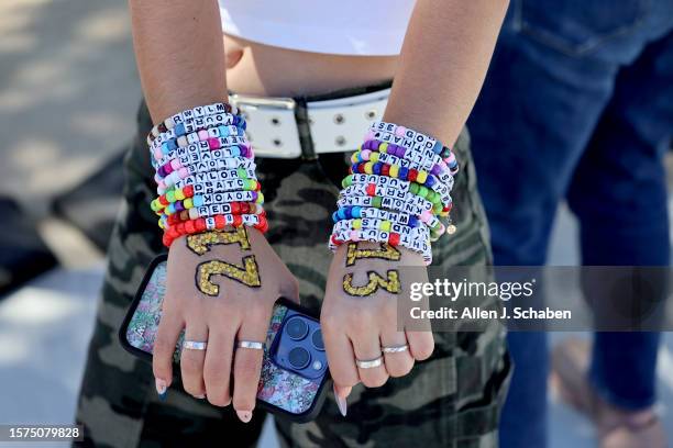 Inglewood, CA Taylor Swift fan Emma Sadeghi, of Glendale, shows her friendship bracelets as she arrives at the emporarily renamed "Speak Now/Taylor's...