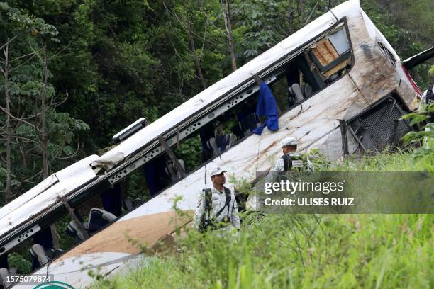 Rescuers work at the site of a road accident in Tepic, Nayarit State, Mexico, on August 3, 2023. At least 18 people were killed and at least 23...