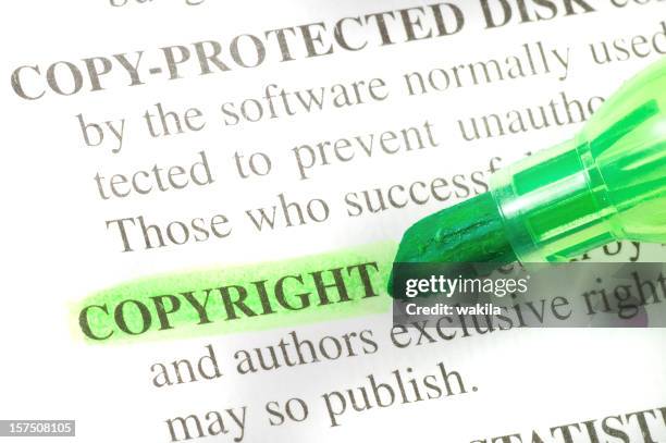 copyright defintion highligted in dictionary - denotation - intellectual property stock pictures, royalty-free photos & images