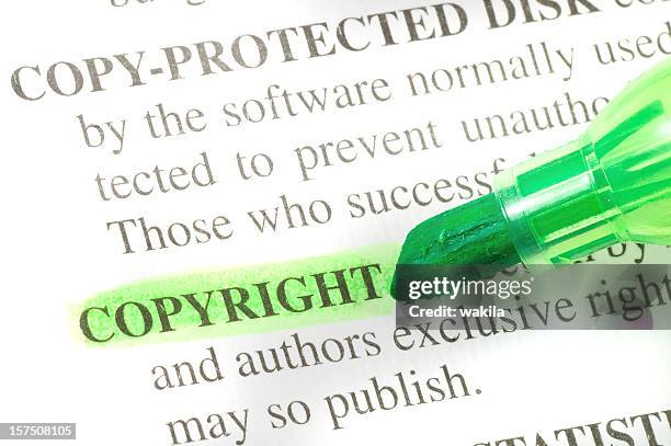 copyright defintion highligted in dictionary - denotation - rights bildbanksfoton och bilder