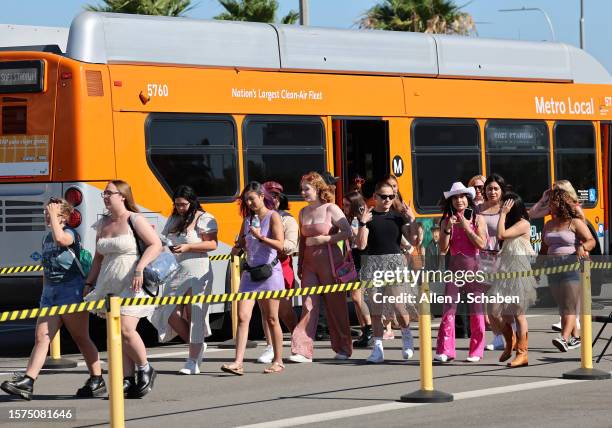 Inglewood, CA A crowd of Swifties arrive on a free shuttle bus from the Downtown Inglewood Station to SoFi stadium to see Taylor Swift perform her...