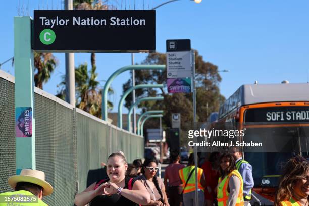 Inglewood, CA Swifties arrive to take a free shuttle bus from the temporarily renamed "Taylor Nation Station" Metro C Line Station to SoFi stadium to...