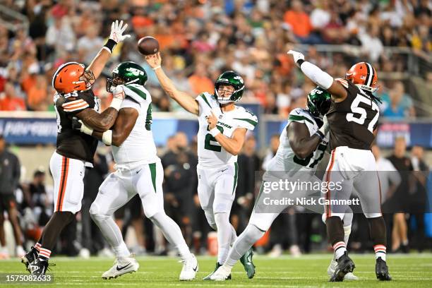 Zach Wilson of the New York Jets throws a pass during the first half of the 2023 Pro Hall of Fame Game against the Cleveland Browns at Tom Benson...