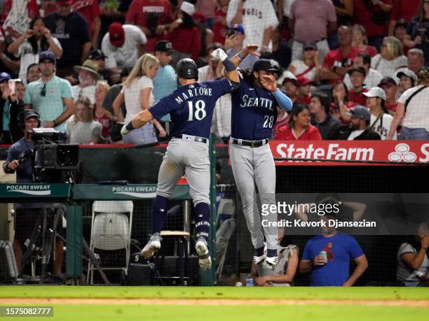 Cade Marlowe of the Seattle Mariners celebrates his grand slam home run Eugenio Suarez against closer Carlos Estevez of the Los Angeles Angels during...