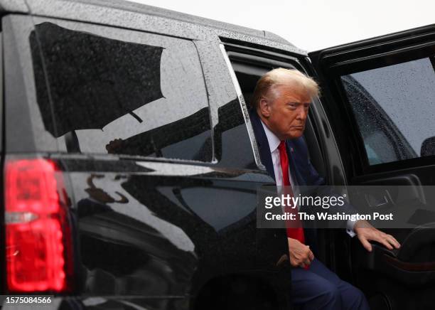 Former president Donald Trump arrives at Ronald Reagan Washington National Airport in Arlington, Va. On Thursday, August 3, 2023 after appearing at...