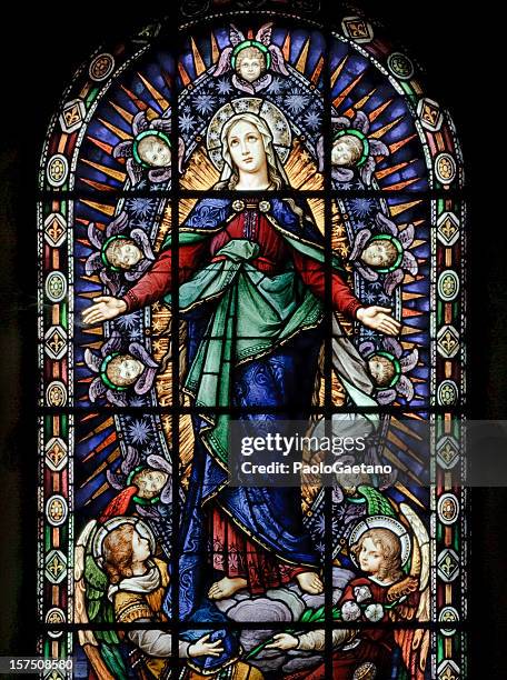 a stained glass window of santa maria - virgin mary stock pictures, royalty-free photos & images