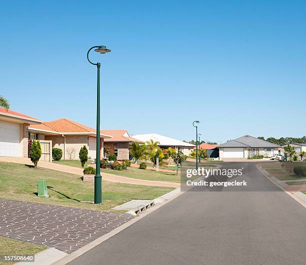 suburban street properties - streets stock pictures, royalty-free photos & images