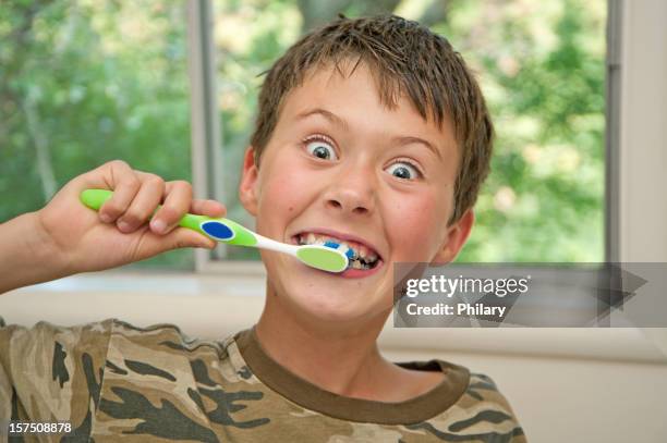 brushing teeth - brushing teeth stock pictures, royalty-free photos & images