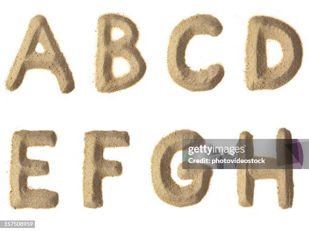 sabbia alfabeto xxxl - carattere tipografico foto e immagini stock