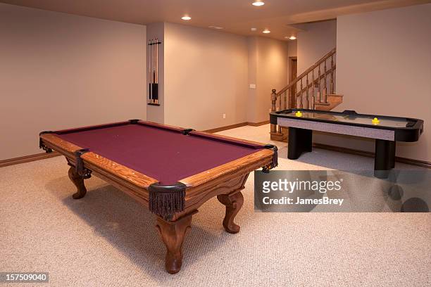 new game room with pool and air hockey tables - basement stock pictures, royalty-free photos & images
