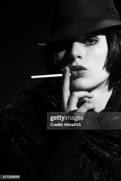 femme fatal: beautiful  woman wearing fedora on black background - portrait femme stock pictures, royalty-free photos & images