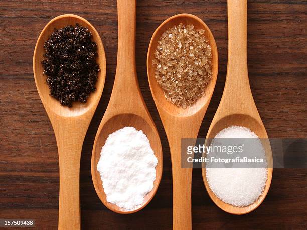 sugar and spoons - brown sugar stock pictures, royalty-free photos & images