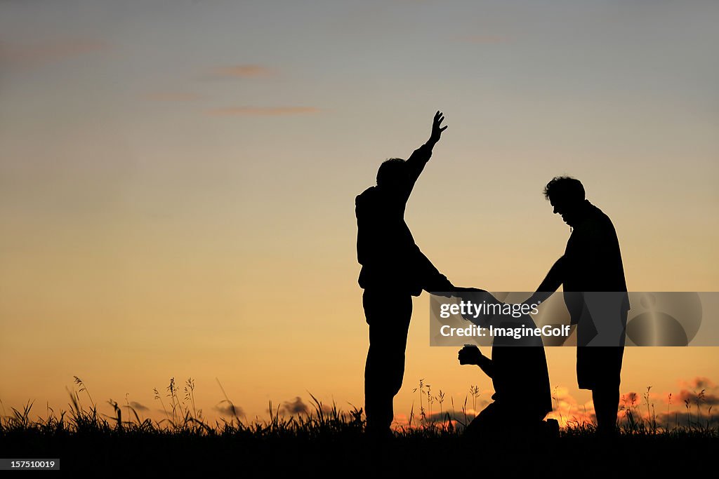 Silhouette of Men Praying