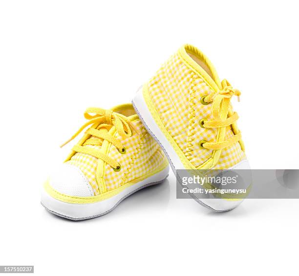 cute yellow baby shoes with laces - baby booties 個照片及圖片檔