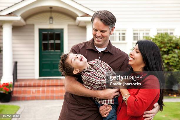 young playful family at home - family smiling at front door stock pictures, royalty-free photos & images