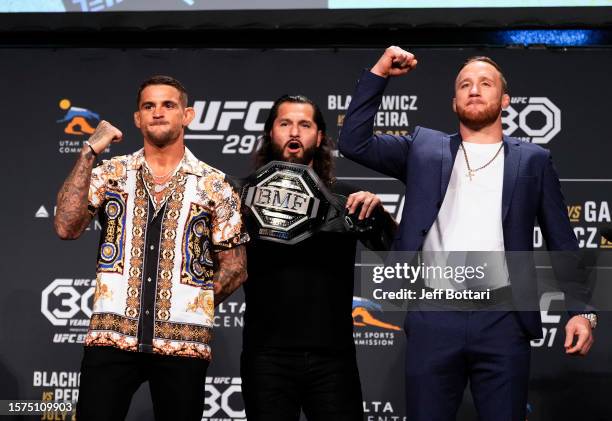 Opponents Dustin Poirier and Justin Gaethje pose as inaugural BMF champ Jorge Masvidal holds the belt during the UFC 291 press conference at Salt...