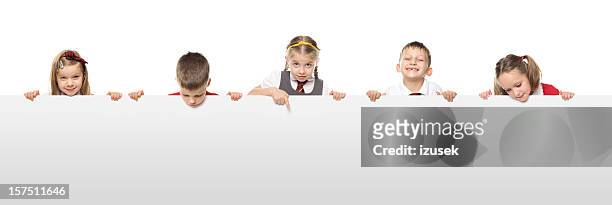 school kids with a blank white board - look down stock pictures, royalty-free photos & images